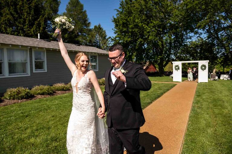 bride and groom celebrating after their outdoor ceremony at pinehall at eisler farms