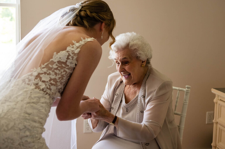 grandma and bride share a moment together before the wedding at pinehall at eisler farm