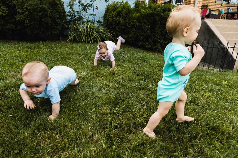 babies running around at a birthday party