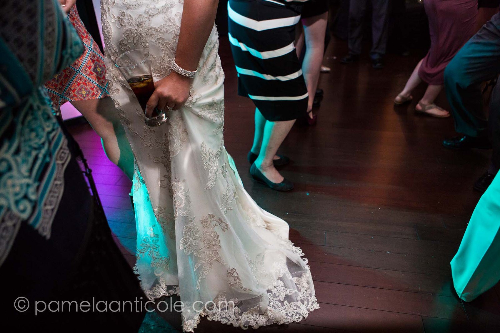 bride with beer on dance floor