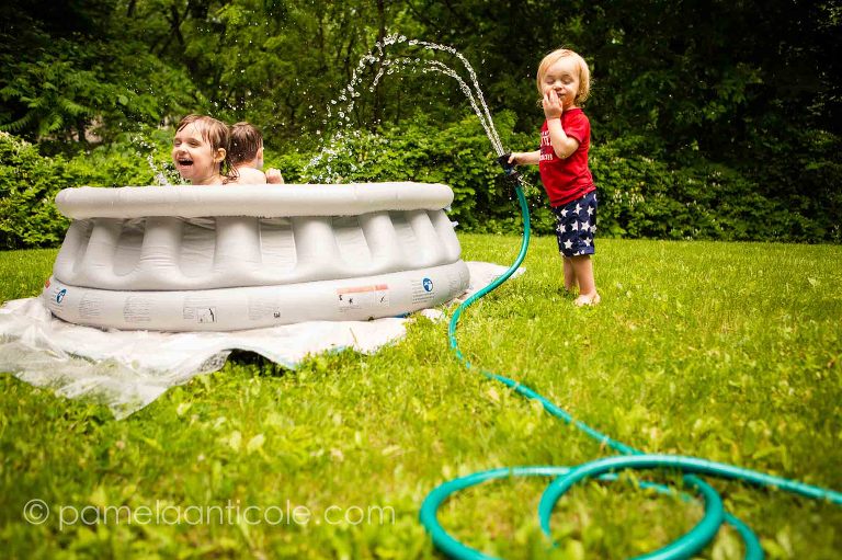 documentary family photographer in pittsburgh, kids swimming in the pool