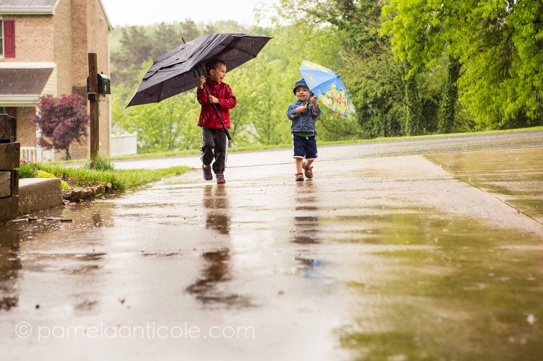 documentary family photo, kids playing in the pittsburgh rain