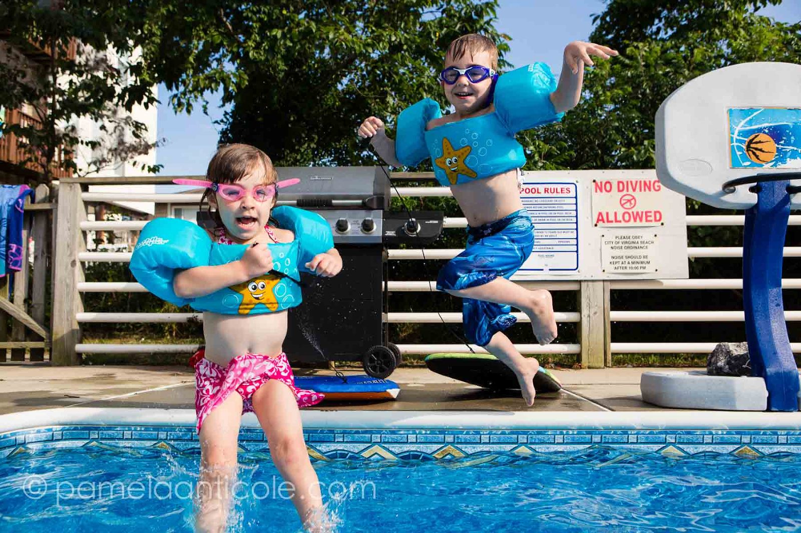 kids jumping into the sandbridge beach house pool