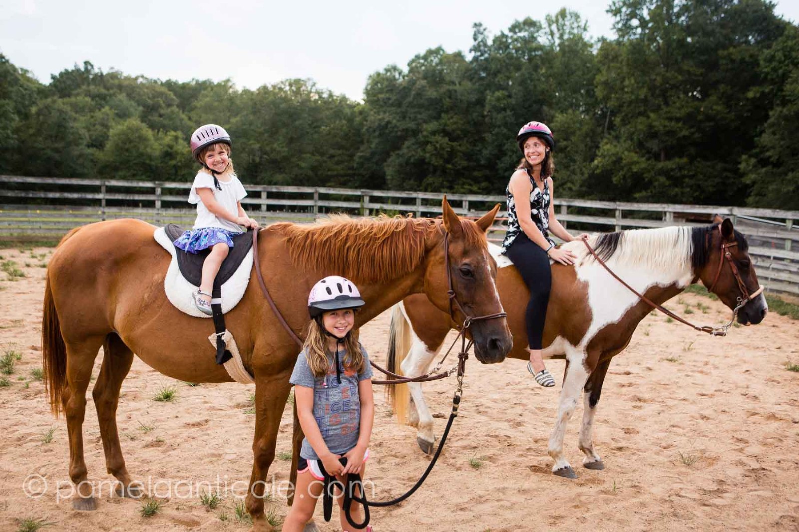 girls riding horses together on the farm