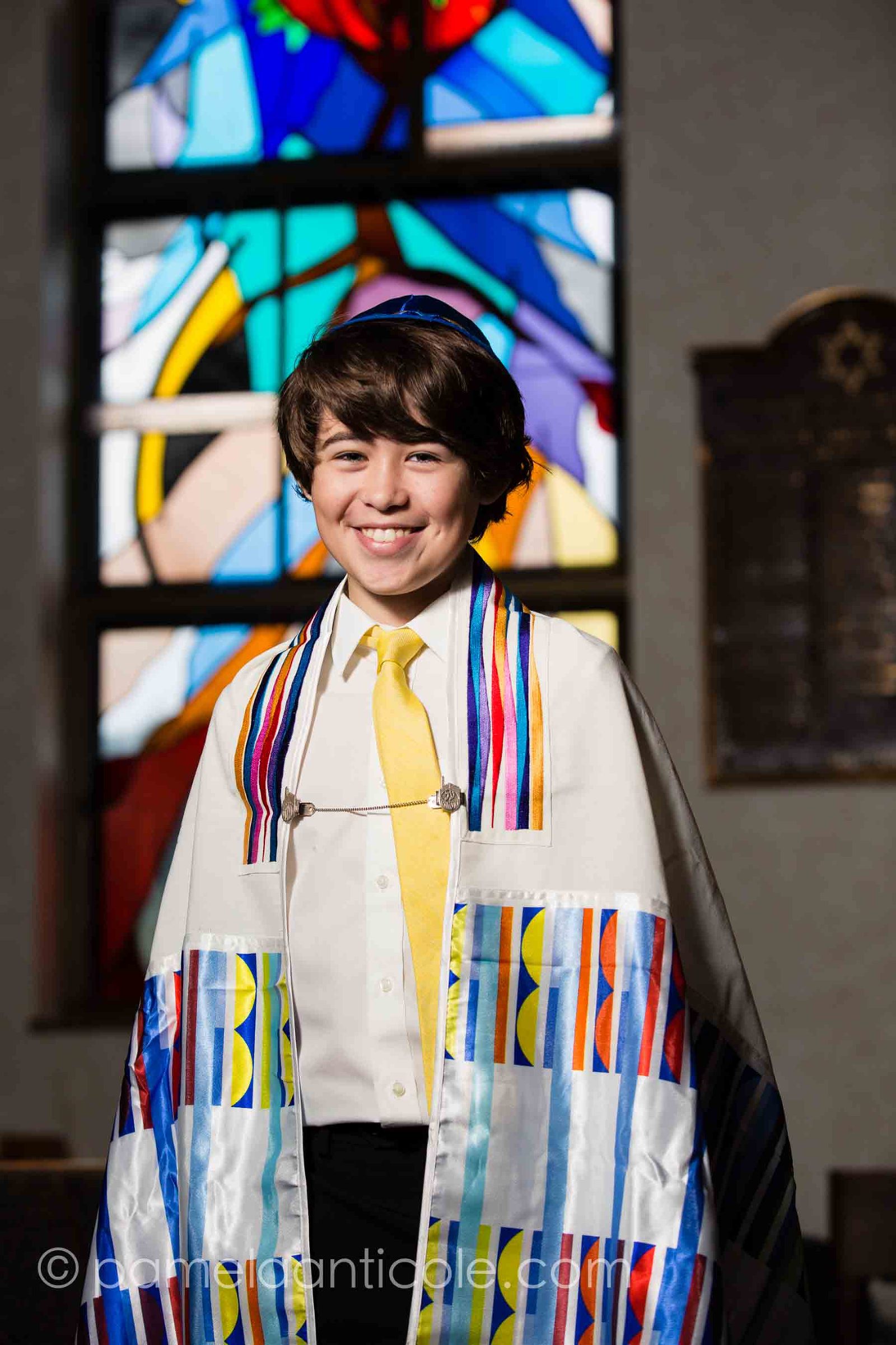 Bar Mitzvah portrait in front of stained glass window at Beth Shalom in Ambridge PA outside of Pittsburgh