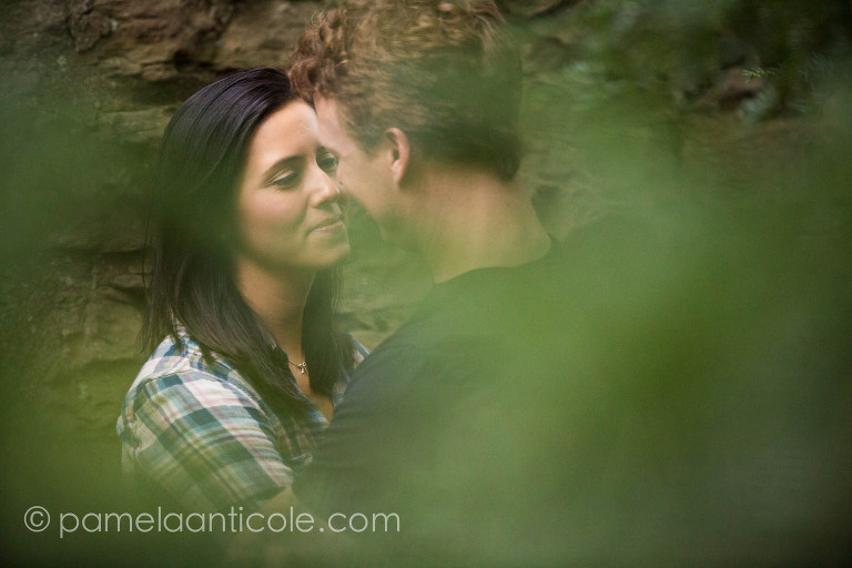bride and groom gazing into each others eyes, up close shot through trees for romantic viewpoint
