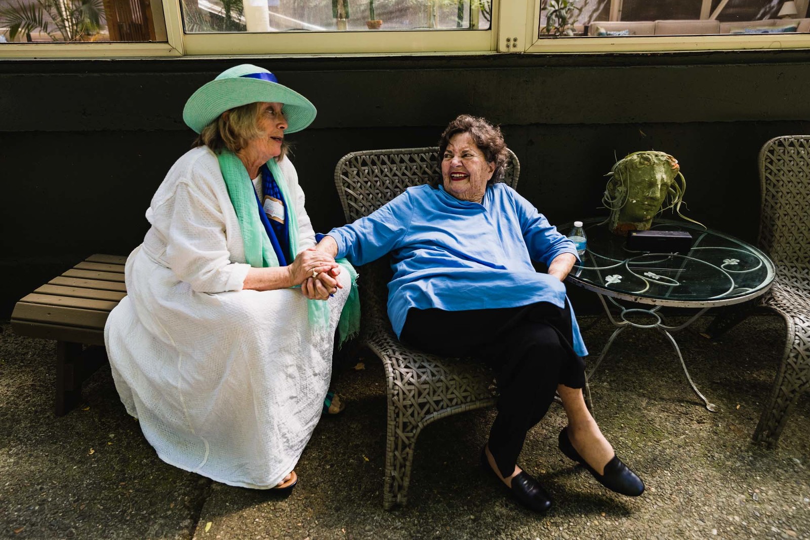 wedding guests smile and hold hands in the garden at pittsburgh wedding venue choderwood