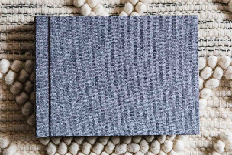 blue linen cover of 5x7 hardback photo album, available in horizontal format