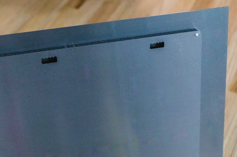 back of a metalprint, with the hanging holes built into the standout mounting option