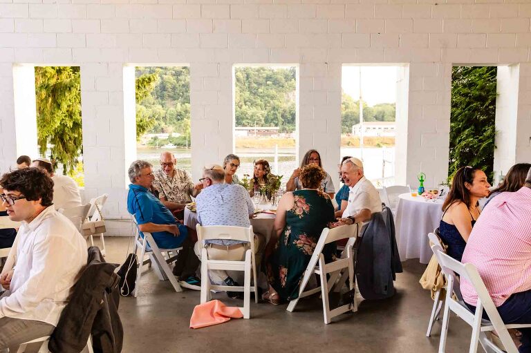 guests sitting in front of a window facing the allegheny river