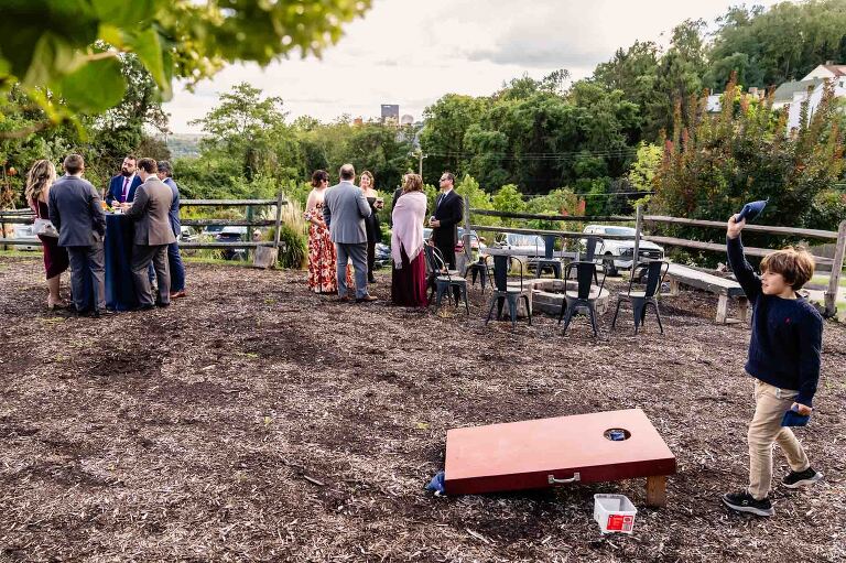 WBU Event Venue wedding photos show off the outdoor space with lawn games overlooking the Pittsburgh city