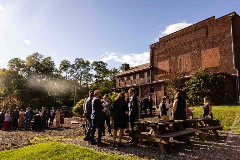 WBU Event Venue wedding photos of the outdoor wedding space, with guests on the lawn in front of the WBU building