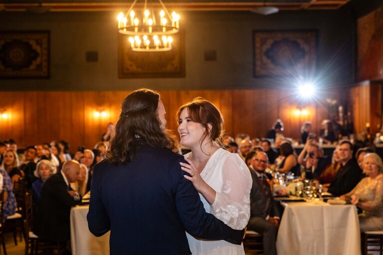WBU Event Venue wedding photos of bride and groom dancing in grand ballroom in front of their guests