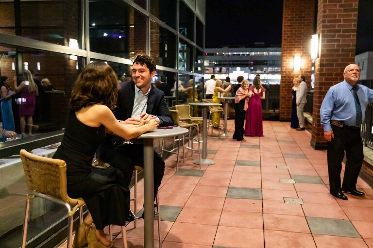 balcony at duquesne power center ballroom, overlooking pittsburgh, where wedding guests mingle during wedding reception