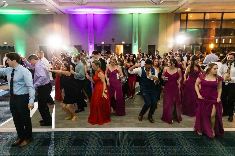 wedding guests dancing on the dance floor in the Duquesne power center ballroom in downtown pittsburgh wedding venues
