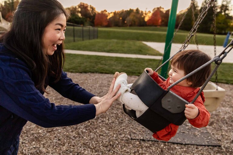 try heading to your local park, for your next pittsburgh photoshoot location. like this mom and her baby girl in the swings!