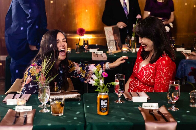 guests laughing together in jess and frankie's wedding photos at spirit pittsburgh, in lawrenceville. 
