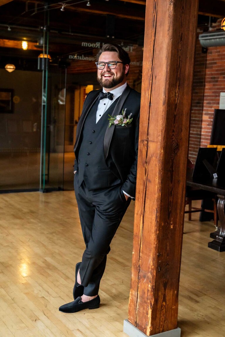 portrait of a groom on his wedding at the heinz history center, in the separate bridal spaces on site at this unique pittsburgh wedding venue