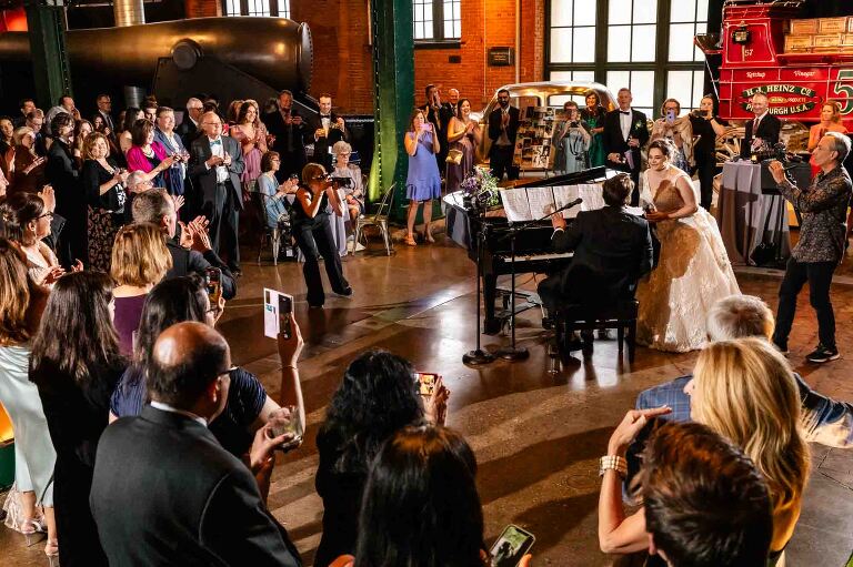 cocktail hour in the grand hall at this heinz history center wedding, photos taken by documentary wedding photographer pamela anticole in pittsburgh pa